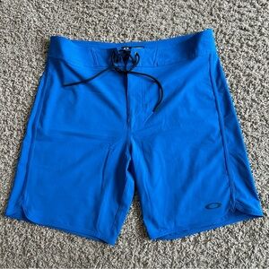 Oakley Men's Performance Fit Board Shorts Size 34 Solid Blue  8" EUC Swim Wear